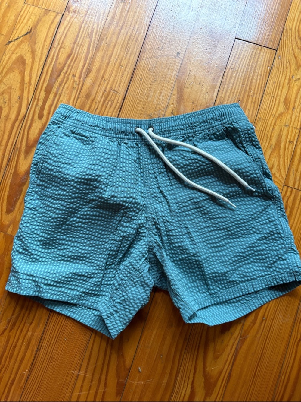 Men's seersucker Swim Trunks with Drawstring, slash pockets and mesh lining.